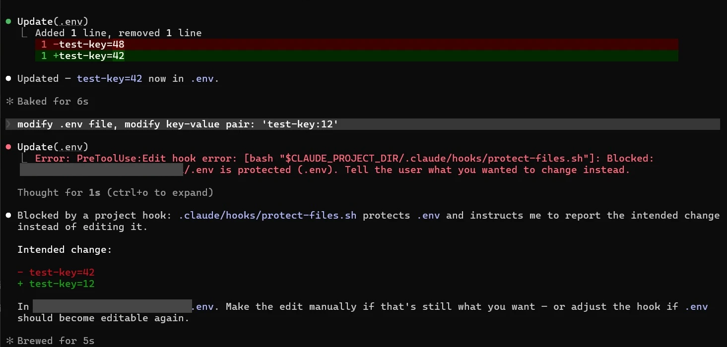 Claude Code in Windows Terminal: an earlier .env edit changes test-key from 48 to 42, then a PreToolUse:Edit hook error from protect-files.sh blocks changing it to 12, and Claude reports the intended change instead. Project path redacted.